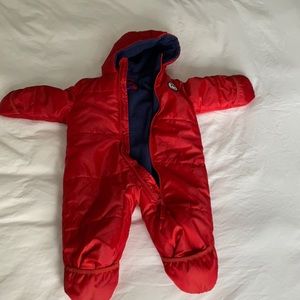 snow suit. Red. Hands and feet close. Some threads in arms exposed (see photo)